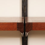 Close-up of a wooden shelves with a beige background