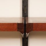 Close-up of a wooden shelves with a beige background