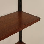 Wooden shelf against a plain wall