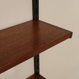 Wooden shelf against a plain wall