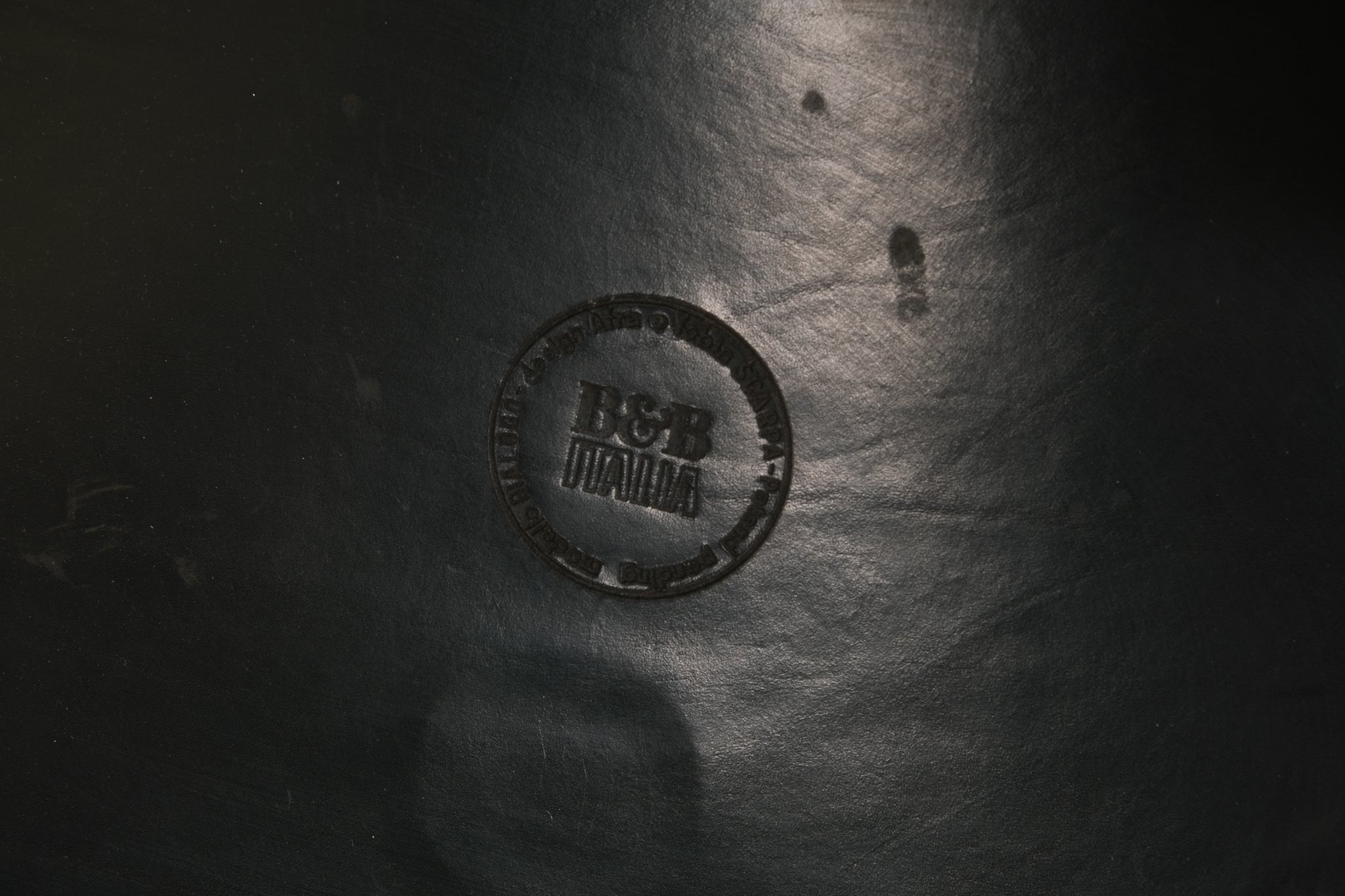 Close-up of a textured surface with a circular logo and text
