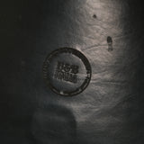 Close-up of a textured surface with a circular logo and text