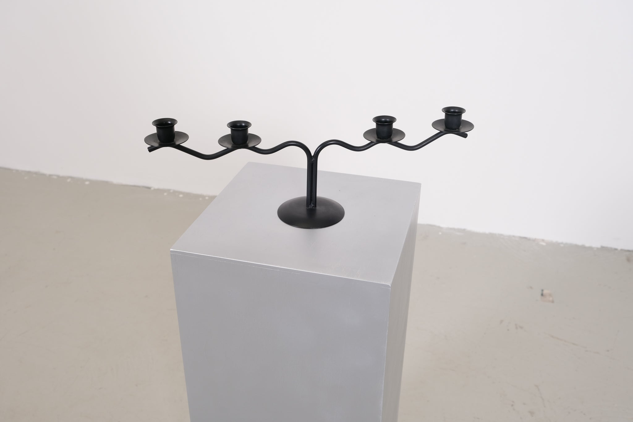 Black sculptural candle holder