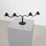 Black sculptural candle holder