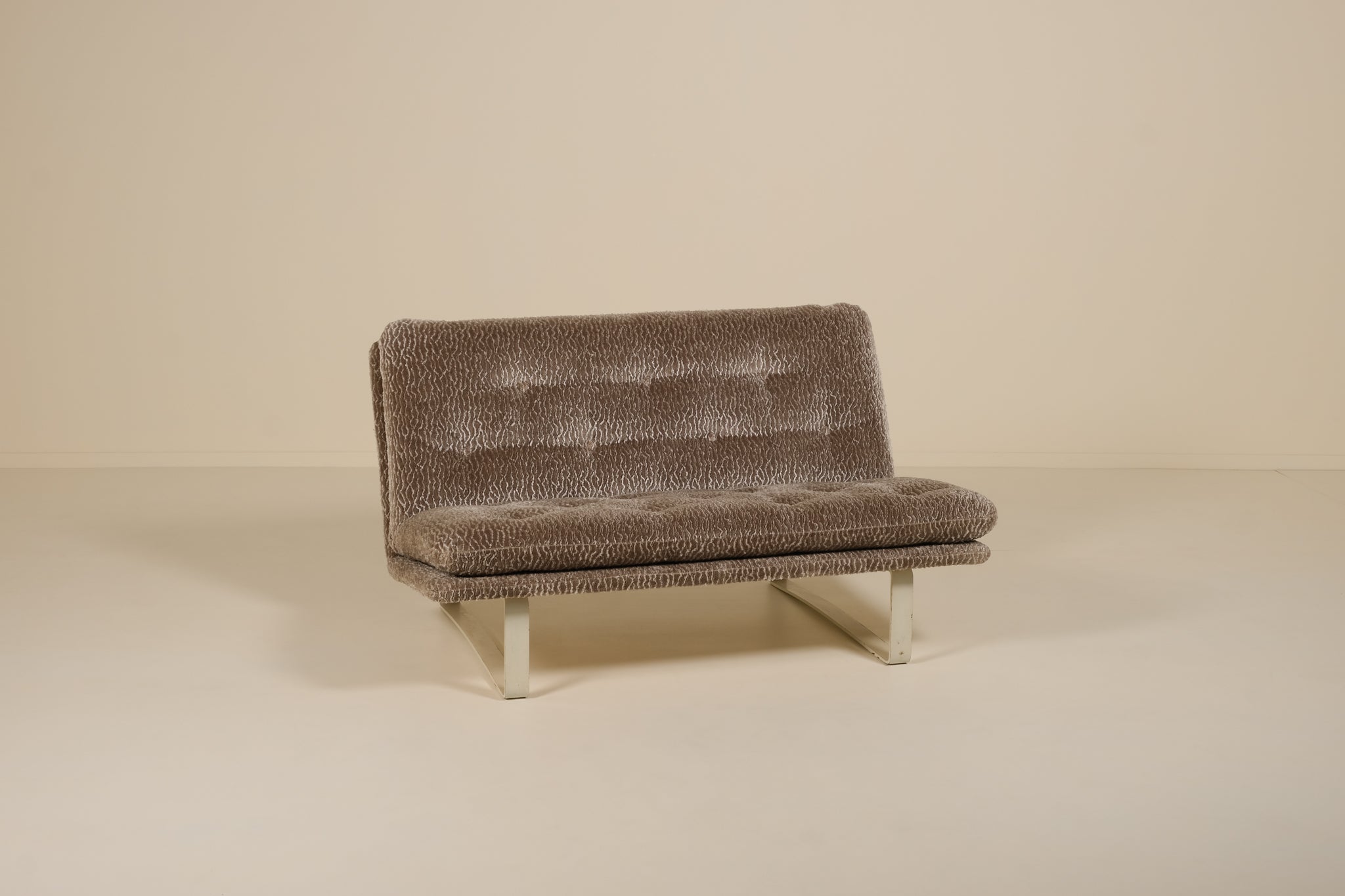 Brown textured sofa on a beige background