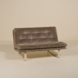 Brown textured sofa on a beige background