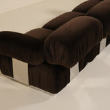 Brown upholstered sofa on a white floor