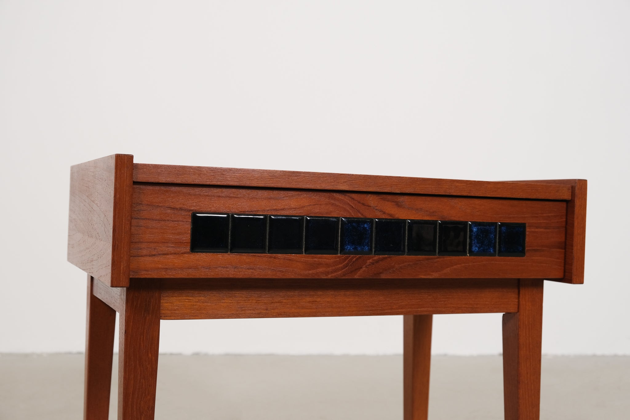 Cabinet with small blue tiles