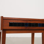 Cabinet with small blue tiles