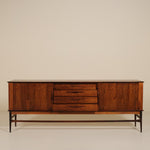 Wooden sideboard with drawers on a beige background