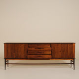 Wooden sideboard with drawers on a beige background