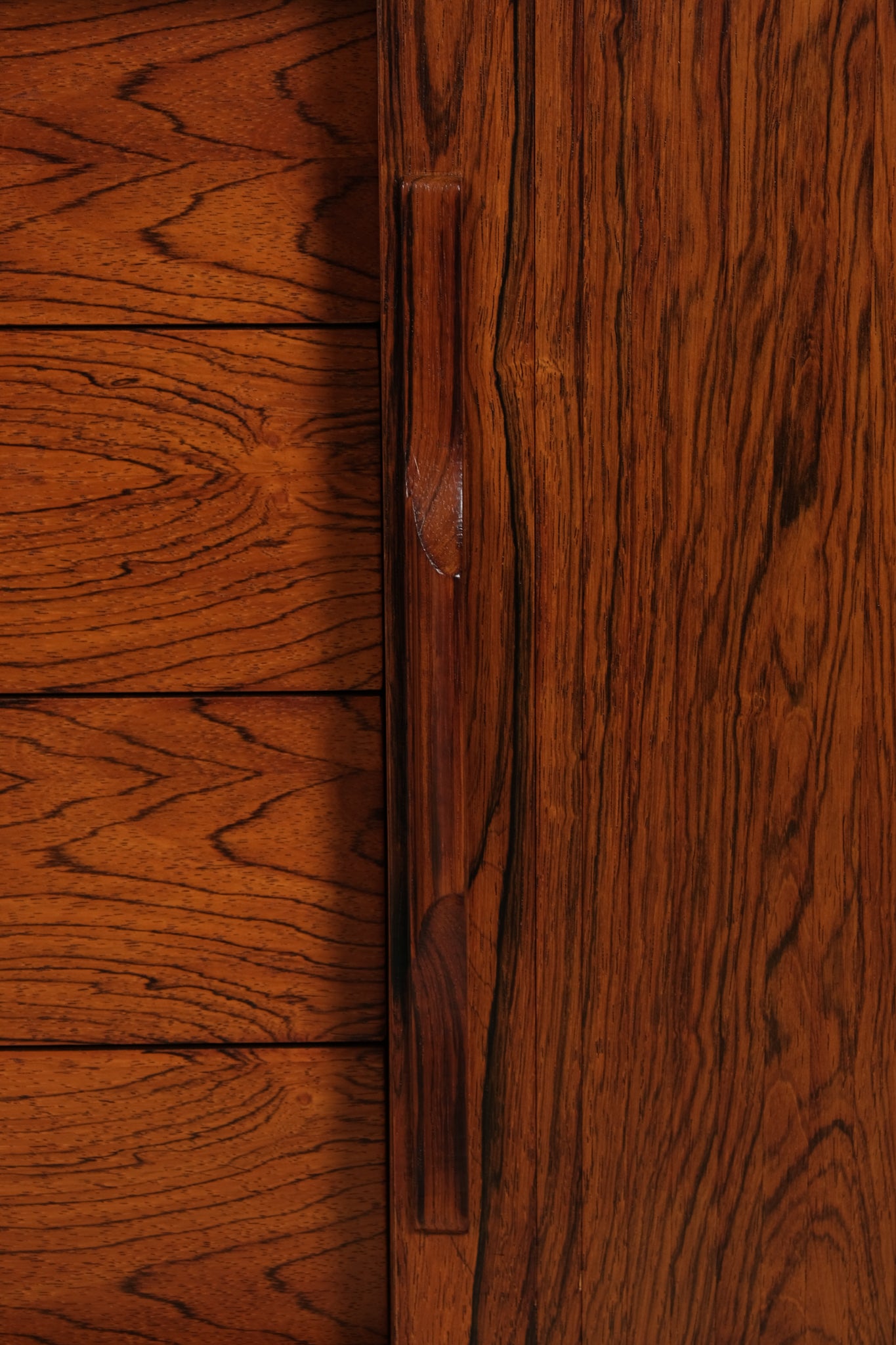 Close-up of a wooden cabinet with a handle