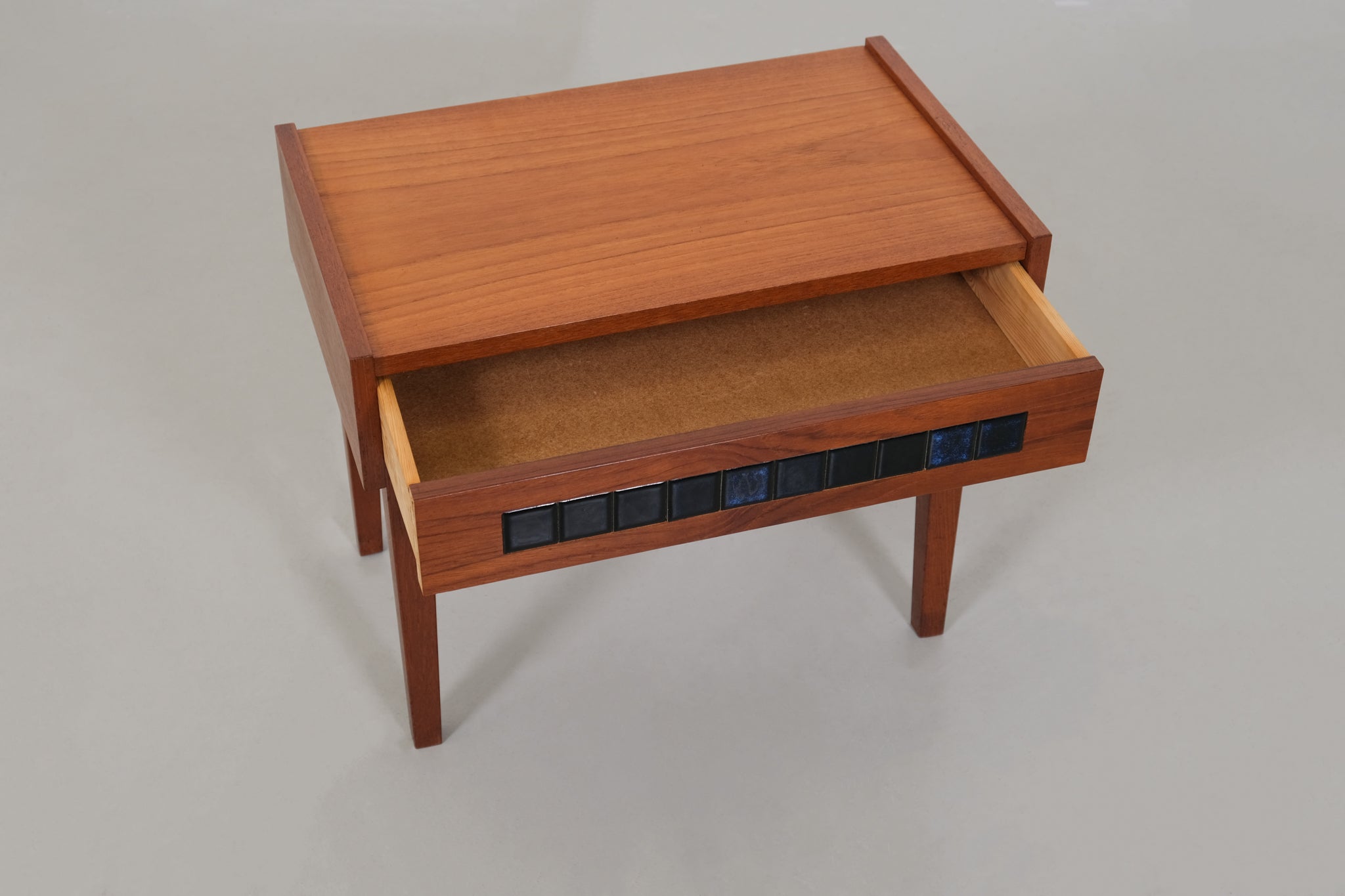 Cabinet with small blue tiles
