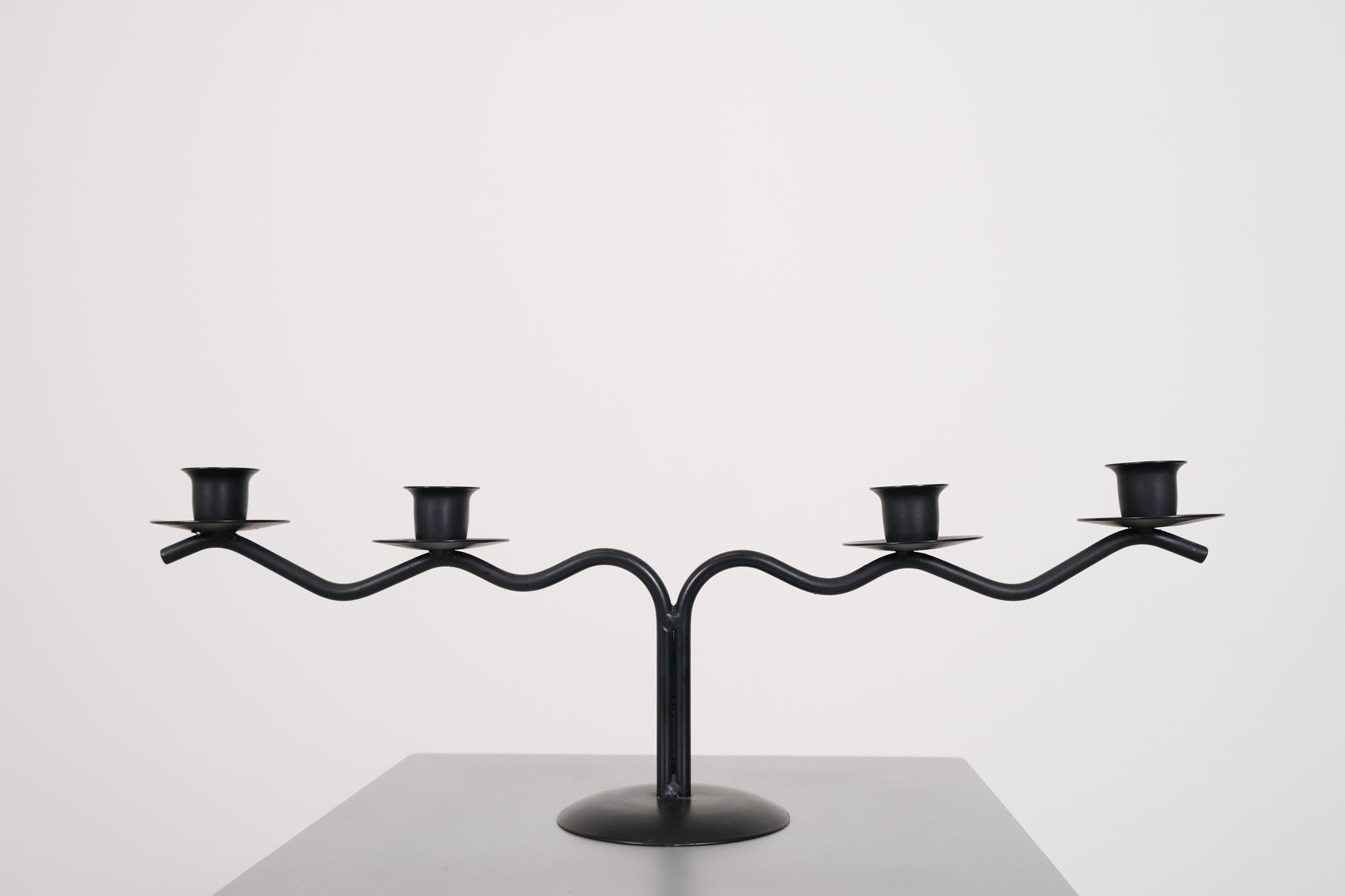 Black sculptural candle holder