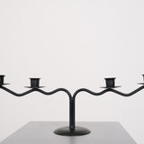 Black sculptural candle holder