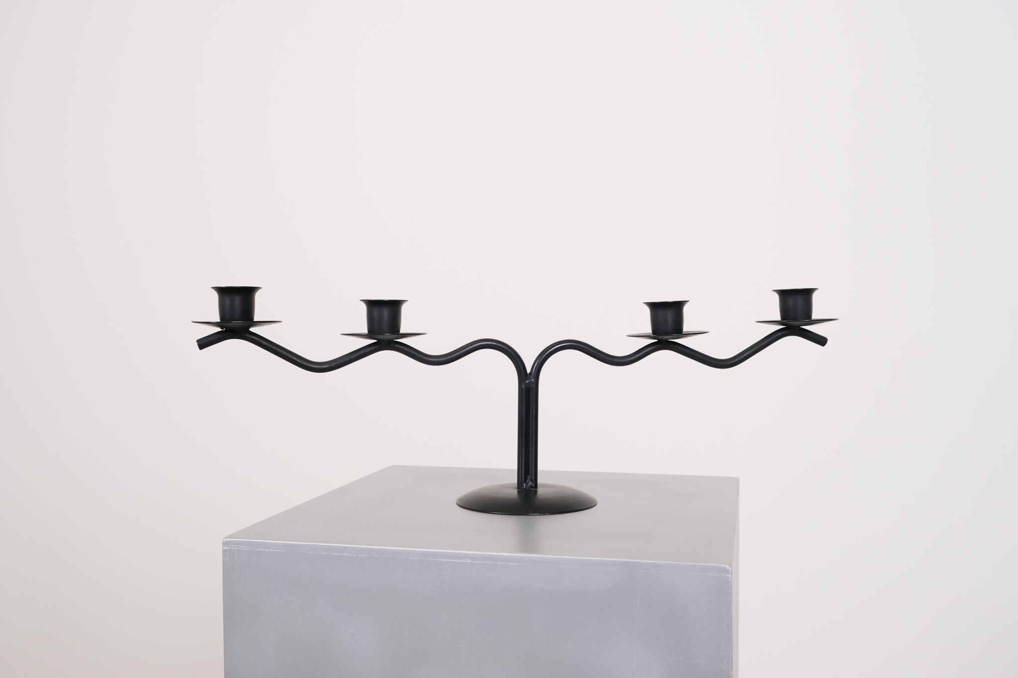 Black sculptural candle holder