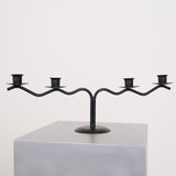 Black sculptural candle holder
